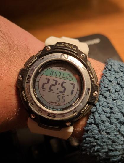 Same casio watch with white tpu straps on a wrist.