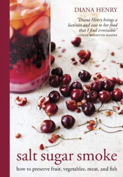 A jar of pickles, or is it a ferment? Cherries on the table with some pips and stems.