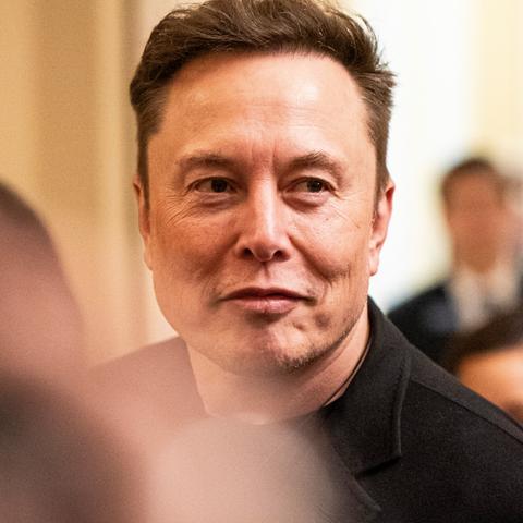 Elon Musk said that he would soon scale back his work with the federal government, in an effort to reassure Wall Street analysts.