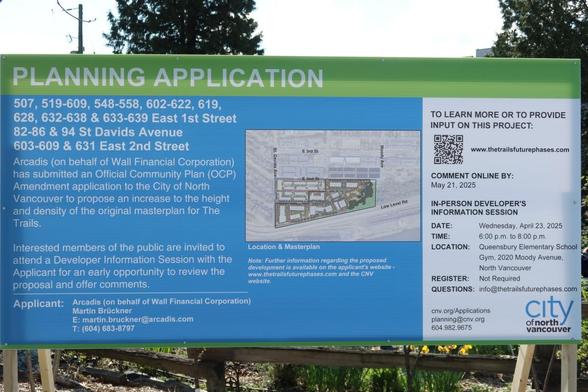 Notice for a Planning Application in Moodyville. The notice board has a map showing a concept for the final phase of the Moodyville development.