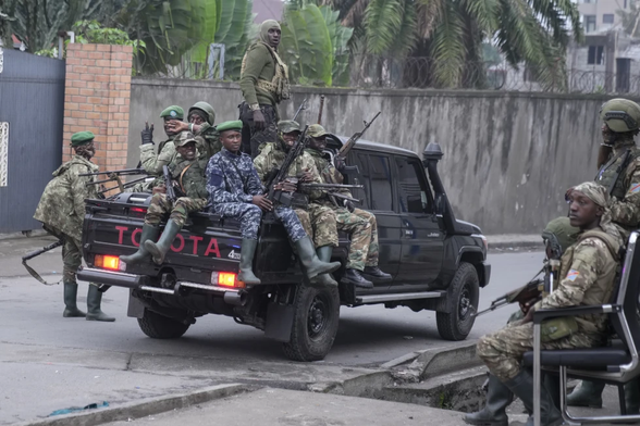 Bunch of armed men sitting in a Toyota Hilux with a snorkel