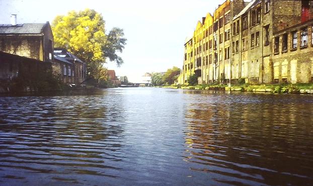 Canal, with decrepit industrial buildings alongside.