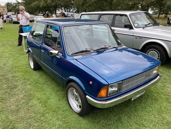 Blue metallic Innocenti Mini, front quarter view