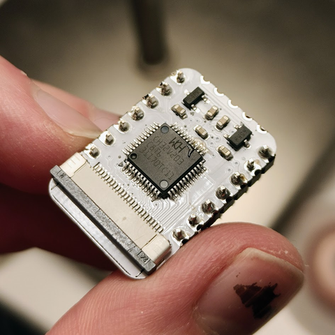 Small circuit board with one microcontroller and a 24-pin camera connector