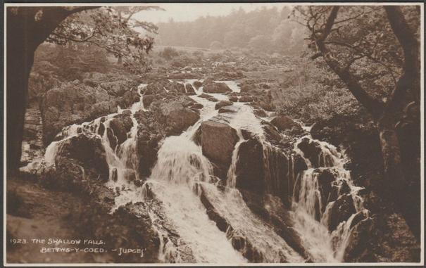 Sepia real photographic postcard showing a view of the Swallow Falls at Bettws-y-Coed in Caernarvonshire.

Published by Judges Ltd, Hastings, No 1923, 1913.

Postally unused.

Very good condition, with minimal corner bumps.