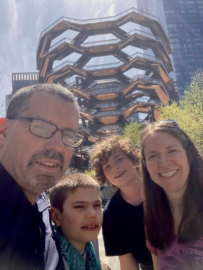 family selfie in front of Vessel in New York City