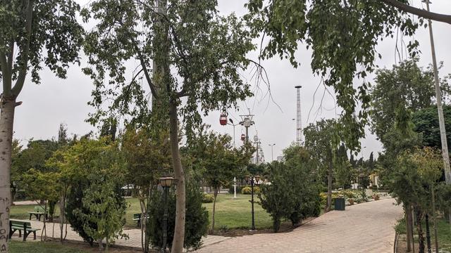 The cable car in a park.