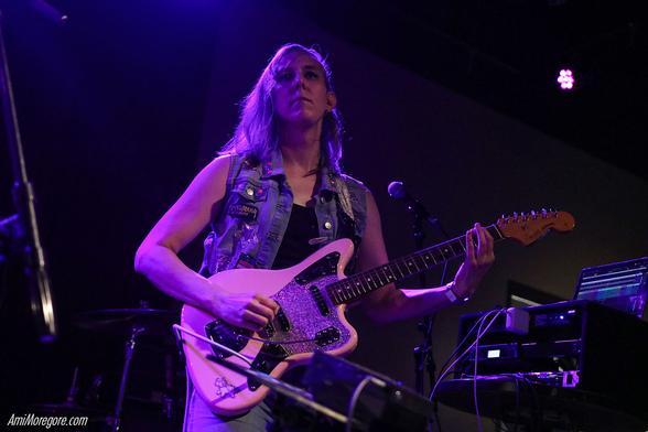 NMLSTYL (pronounced "Animal Style") Playing guitar on stage