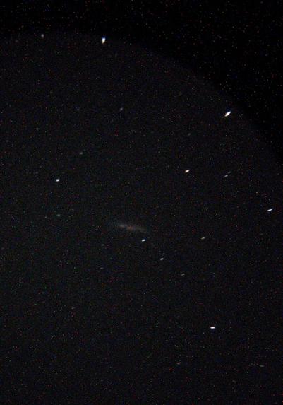 A picture of the galaxy M82, taken using my smartphone. It's much noisier and grainier than the DSLR.
