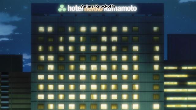 A night view of a building with a signboard saying hotel nekko kumamoto