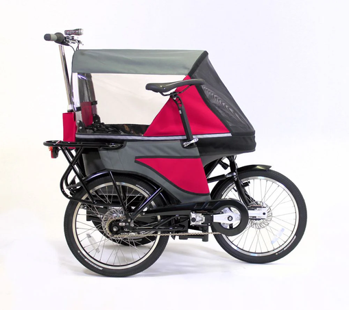 A three wheeled stroller with a bicycle handlebar at the back and a bicycle chain, geared hub, taillight and a saddle on its right side. It has a canopy in grey and pink with windows all around. Profile view from the right side.