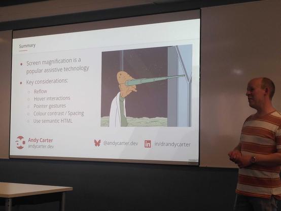 Andy in front of a slide summarising his talk, with a Futurama gif.