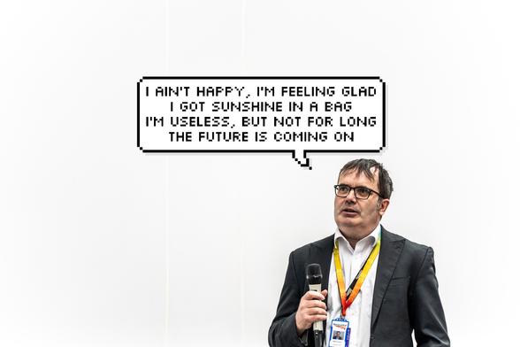 The same bloke but with a preemptive speech bubble with the lyrics "I ain't happy, I'm feeling glad/I got sunshine in a bag/I'm useless, but not for long/the future is coming on" from "Clint Eastwood" by The Gorillaz
