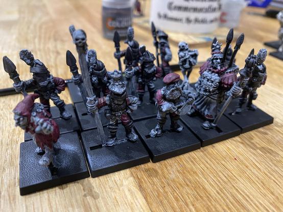 A regiment of Oakbound Spearmen with some additional characterful additions. They are partially painted.