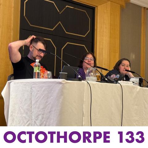 John, Alison and Liz are sat behind a table at Reconnect doing a live podcast. The words “Octothorpe 133” appear at the bottom.