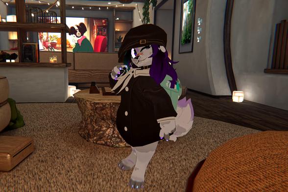 The photo shows an anime-style furry character, wearing a dark-colored coat and a newsboy cap, standing in a living room. The character appears to be in a virtual environment, possibly a video game. A television showing an anime is visible in the background. The character is positioned near a low, tree-trunk-shaped table.