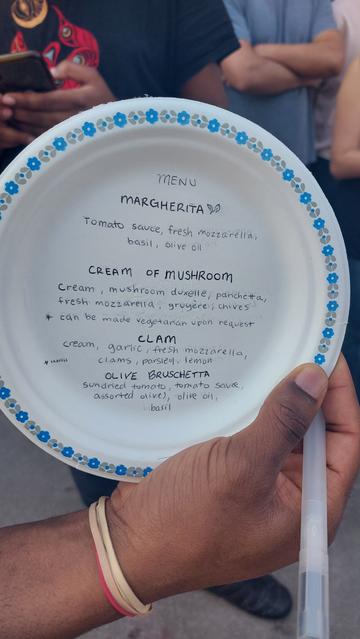Paper plate with pizza options written