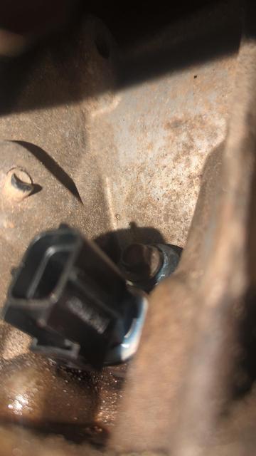 A closeup of the same sensor, showing the bolt location. Naturally it's on top of the sensor, which makes it much harder to access.