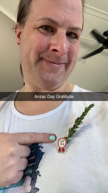Not the most flattering shot of me, but that's really not the point. Which is why I posted it anyway. Wearing a gentle, warm smile, and a white tee, I am pointing one finger to the badge that is pinning a sprig of rosemary (I even hate rosemary!) to it. It reads (backwards) "STILL ALIVE". That badge holds varying sentiment, but without them, I likely wouldn't be.