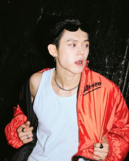 Yeonjun with blue eyes and a red jacket - backstage, 2025