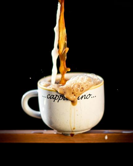 a cup overflowing with cappuccino