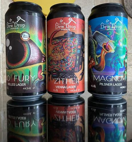The colourful cans of beer from the Dew Drop brewery.
No Fury - Helles Lager, a weird eye on a greenish background
Zither - Vienna Lager, a reddish design with some strange crab-like creature, half-robot??
Magnum - Pilsner Lager, bluish can, with what looks like an elephant with a brass trumpet for a trunk blowing bubbles