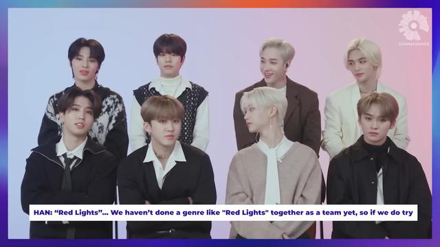 skz members during an interview. Han says, '"Red Lights" ... We haven't done a genre like "Red Lights" together as a team yet, so if we do try'