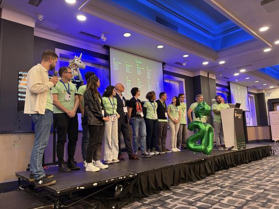 The team on stage during the closing ceremonies