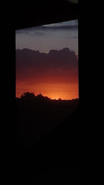 picture of sunset from a window, pitch black