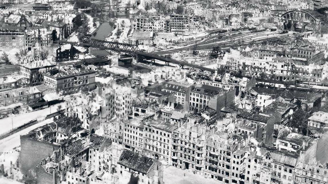Aerial Image of Berlin in black and white with destroyed and bombed streets and buildings.