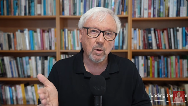 A middle aged man with grey hair