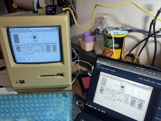 JetKVM on top of a Macintosh Plus running Klondike. Screen is mirrored in the JetKVM webpage on a Linux laptop next to it.