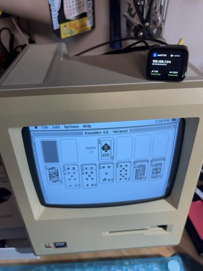 Closeup of JetKVM onto of Macintosh Plus