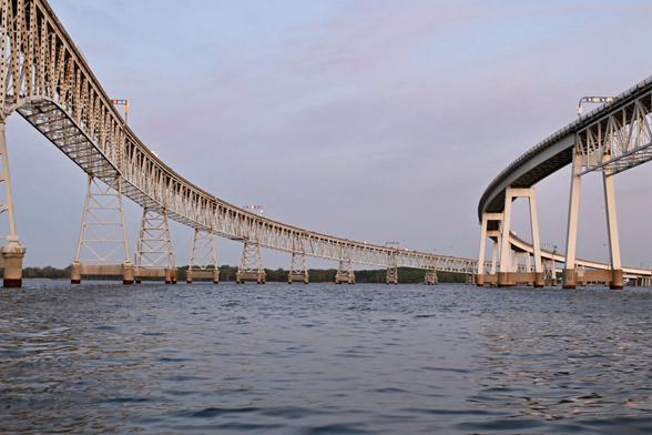 The two spans of the bay bridge showing the curve in bridge from the water.