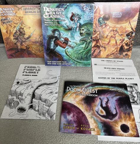 An array of book covers, including a slipcase set of four Tome of Adventure books, a Peril on the Purple Planet GM screen, stretch goal packet, player’s guide, art book, and backer-exclusive bonuses.