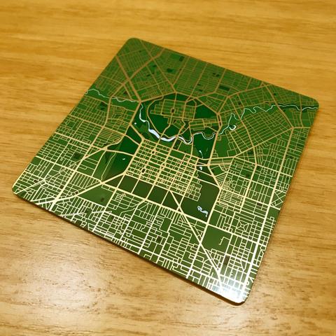 Photo of a map of the Adelaide city area. The map is made of a printed circuit board, with the roads resembling electrical traces.