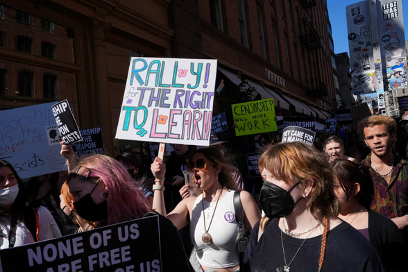 Protestors in New York holding placards that include ‘Rally for the right to learn’ - caption ‘People take to the streets in New York on April 17 for a ‘Rally for the Right to Learn’ © Reuters’