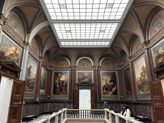 Entrance hallway with grande paintings on the wall