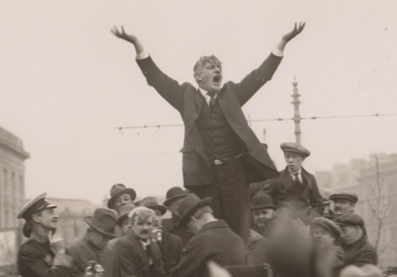 James Larkin standing above a crowd with his hands held aloft.