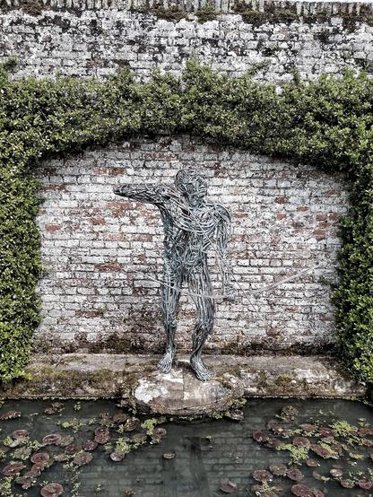A wire statue of an archer - in memory of the current Viscount's father who died in 1991.