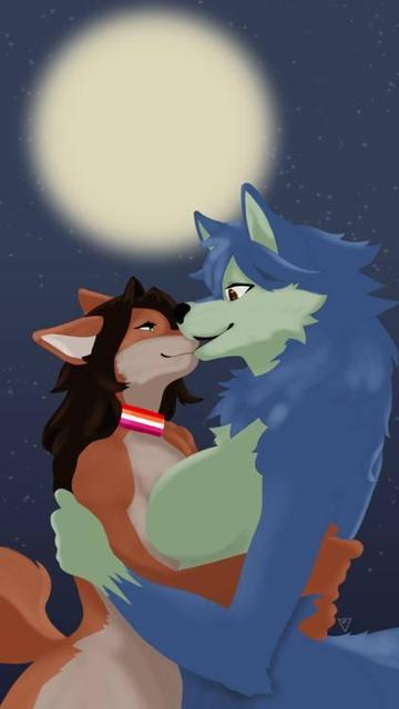 Two anthropomorphic female lesbian wolves, one with light brown fur and the taller one with blue fur, lock gazes and are about to kiss under the moonlit sky. On Lesbian Visibility Day, let’s celebrate love in all its forms and shine brighter than ever!