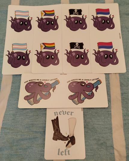 Lots of stickers with a cute purple octopus. Four sets have the octopus waving a flag: trans, gay, pirate and bi flags respectively. Another set has the octopus wrapped around a bottle with a message inside. Above is the text "You wrote me a lovely letter". There's one sticker at the bottom with the foot touch and the text "never left".