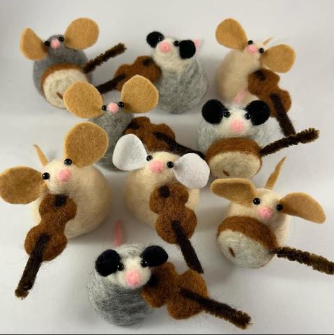 Nine adorable needlefelt mouse-like critters. They’re about two inches tall with beady eyes and they’re all playing either a banjo or a fiddle