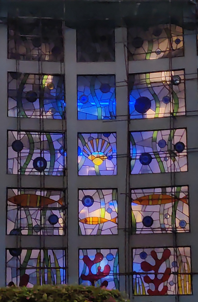 Stained glass windows, mostly blue-toned, motives of sun, plants and fish

#CowrieShells #Hotel
#Shanzu #Mombasa #Kenya