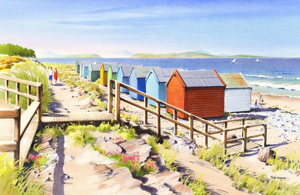 A view of colourful beach huts on a beach with a path along the sea wall behind (at left). In the foreground is a wooden boardwalk area at left and, in front of the beach hts, the steps down to the beach. To the extreme left we see the woodland of Culbin Forest on the far side of the tidal Findhorn Bay, where the River Findhorn empties into the sea. In the distance, across the water is the shoreline of the Black Isle, with the mountains of the far North of Scotland in the distance.