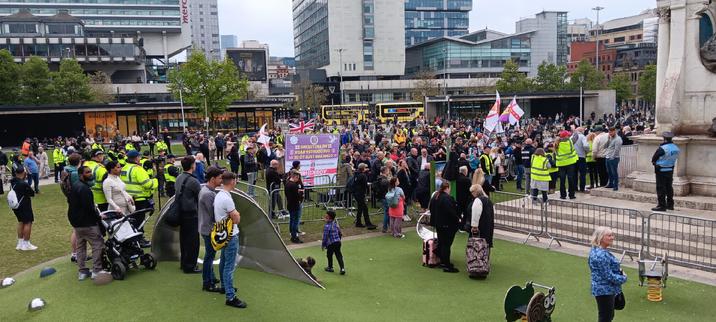 A far-right demonstration gathered in Piccadilly Gardens, Manchester. They have England flags, Free Tommy Robinson and UKIP signs.