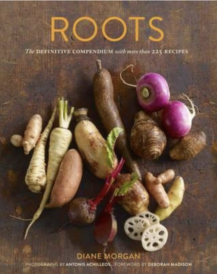The cover with a collection of root vegetables. Brown background and gold and white text.
