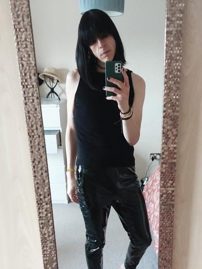 Non binary person in a goth style outfit