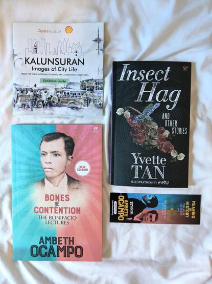 Ayala museum booklet for images of city life, bones of contention the bonifacio lectures by ambeth ocampo, insect hag by yvette tan, and a bookmark of the Rizal lectures
