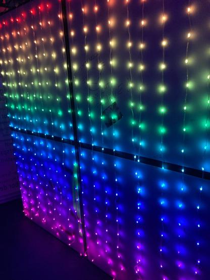 LED banner made of spherical lights displaying horizontal rainbow stripes